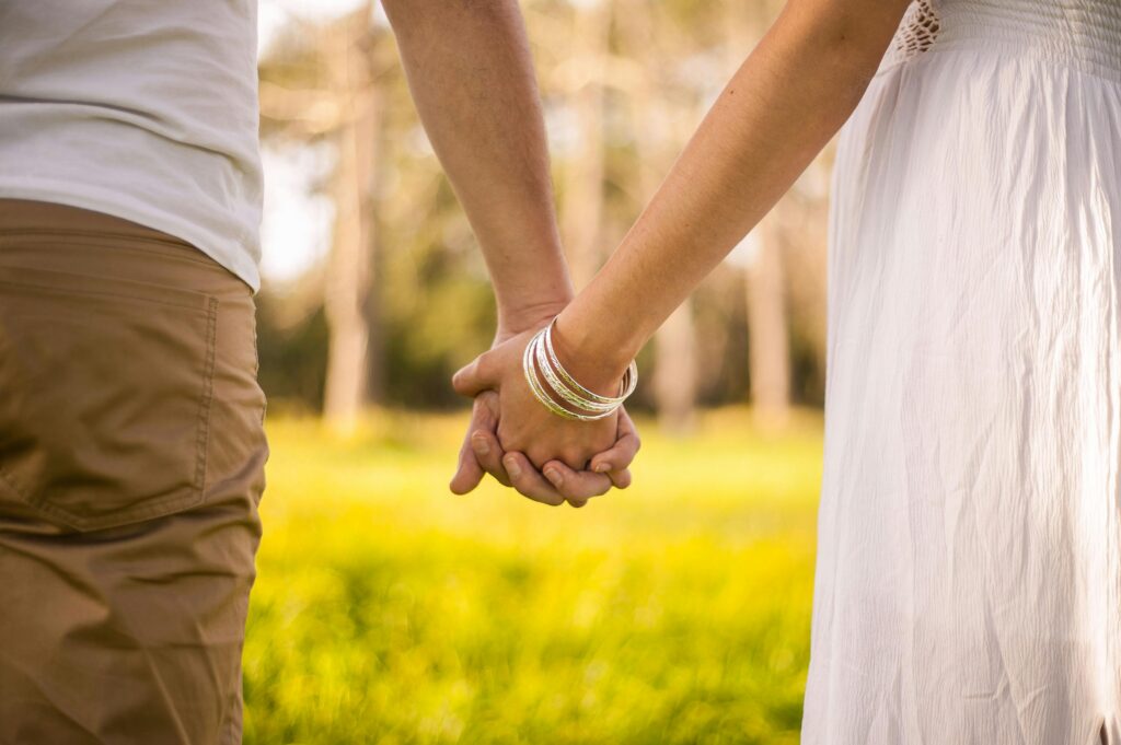 Husband and wife holding hands