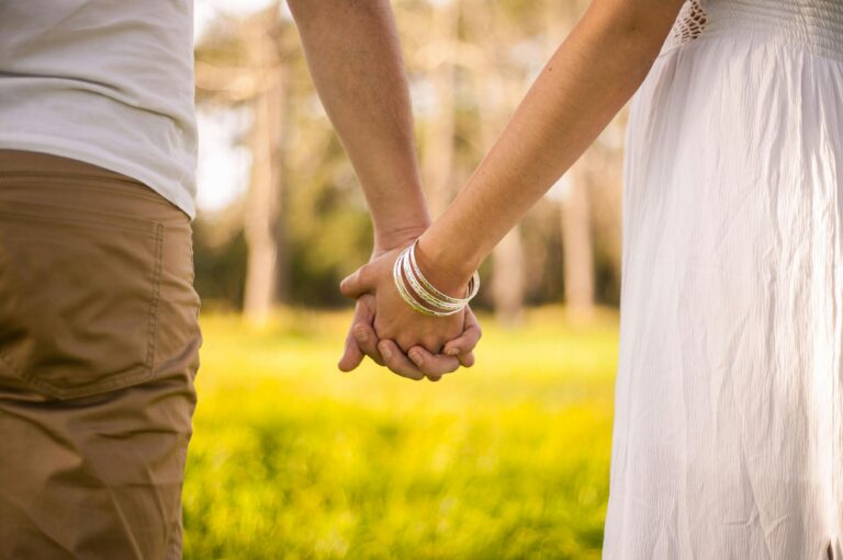 Husband and wife holding hands