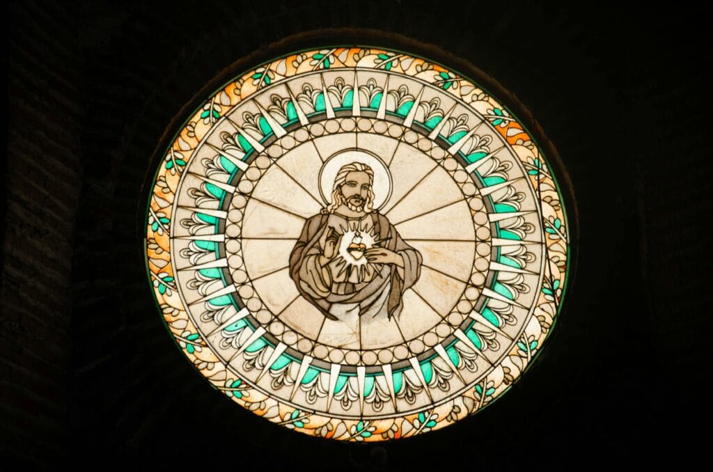 pexels photo 4624262 4624262 Circular stained glass window illustrating Jesus Christ, a serene religious artwork.