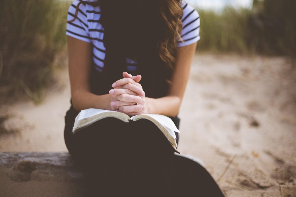praying with bible beach, nature, girl, leisure, outdoors, person, praying, recreation, relaxation, sand, solo, woman, brown beach, brown relax, brown pray, brown sand